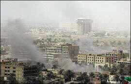 Battles Rage in Baghdad as US Forces Say They Have Surround Battered City; Iraqis Deny the Claim