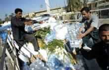 Iraqis Head to Fallujah with Supplies